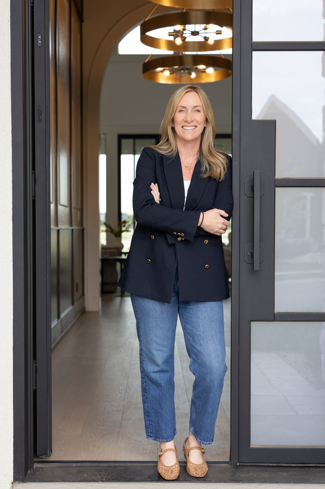 Morgan Hoffman, Boise real estate broker, standing in the doorway of a home